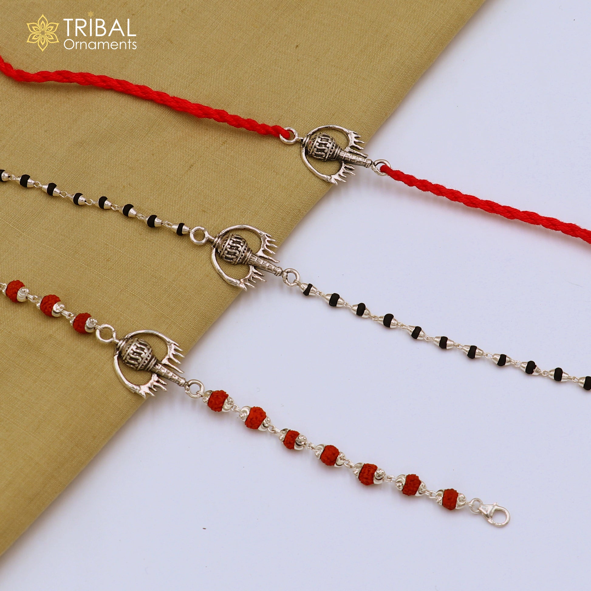 Sterling silver Hanuman weapon and Gota bracelet Rakhi with intricate tribal design, crafted by TRIBAL ORNAMENTS.