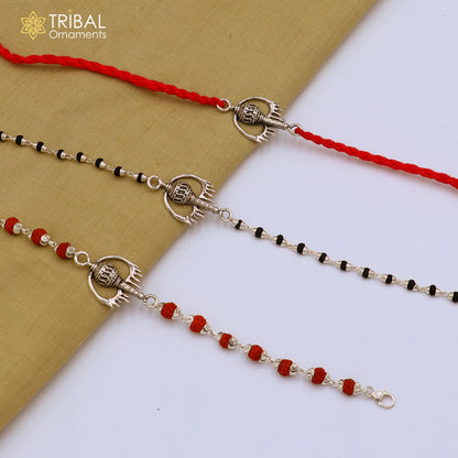 Sterling silver Hanuman weapon and Gota bracelet Rakhi with intricate tribal design, crafted by TRIBAL ORNAMENTS.