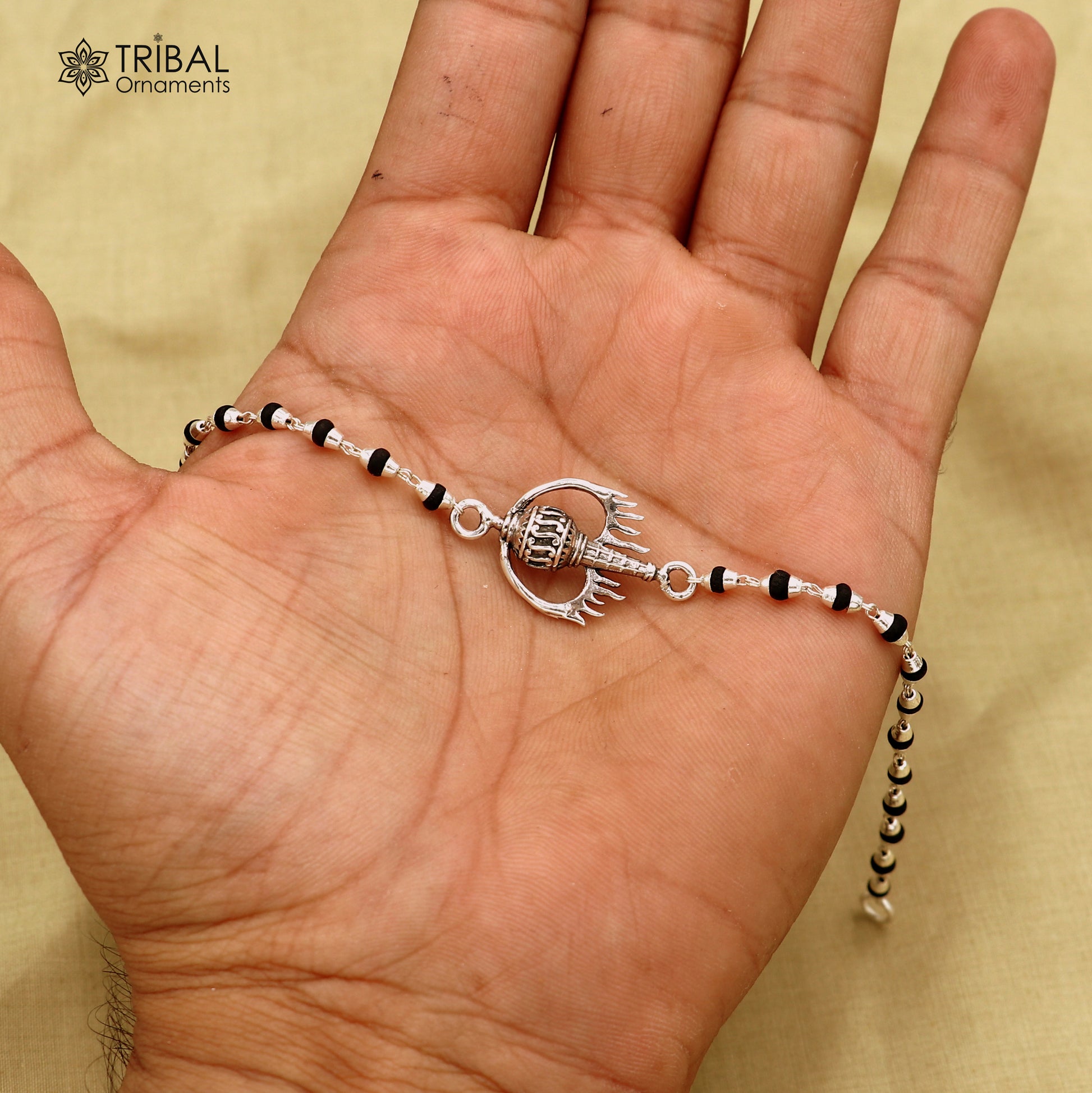 925 sterling silver Hanuman weapon and Gota bracelet Rakhi with intricate tribal design, crafted by TRIBAL ORNAMENTS.