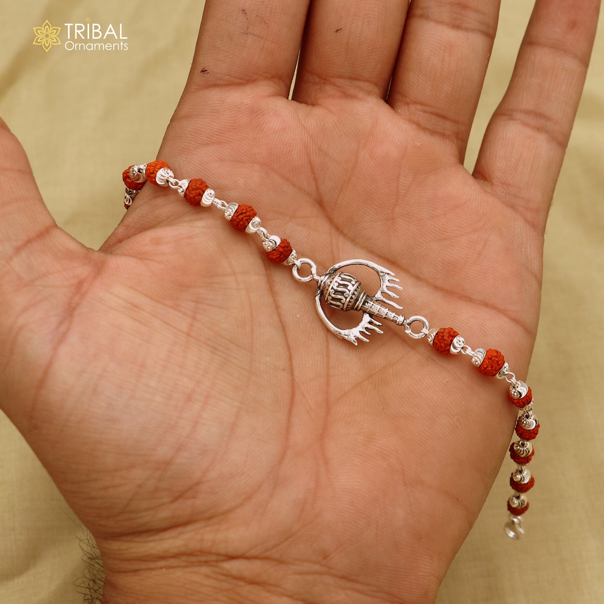 925 sterling silver Hanuman weapon and gota bracelet rakhi by Tribal Ornaments featuring intricate tribal silver design.