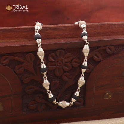 Unisex bracelet with 925 sterling silver black basil rosary beads and tulsi plant wood beads, tribal-inspired jewelry design.