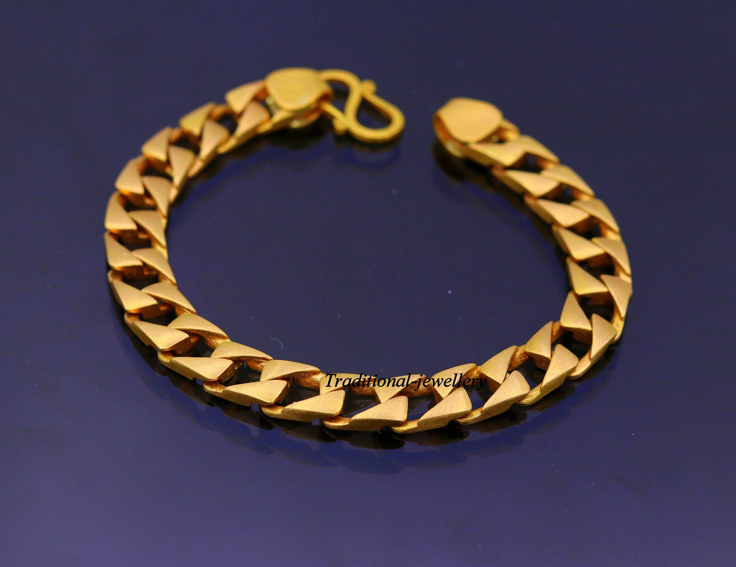 22kt yellow gold handmade solid Cuban chain bracelet, 9mm wide, heavy men's jewelry with hallmarked 916 from TRIBAL ORNAMENTS.