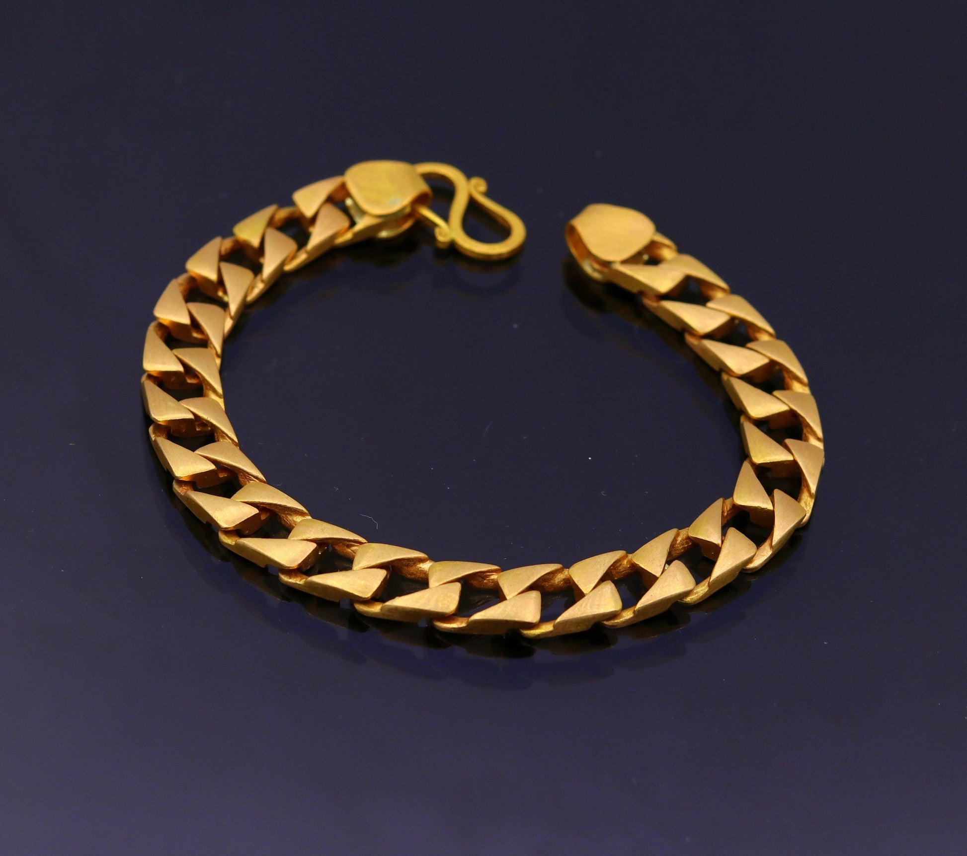 22kt yellow gold handmade solid Cuban chain bracelet, 9mm wide, heavy men's jewelry with hallmarked 916 from TRIBAL ORNAMENTS.