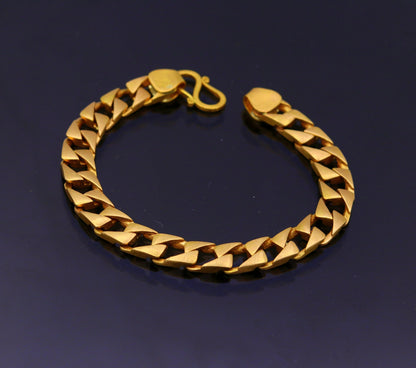 22kt yellow gold handmade solid Cuban chain bracelet, 9mm wide, heavy men's jewelry with hallmarked 916 from TRIBAL ORNAMENTS.