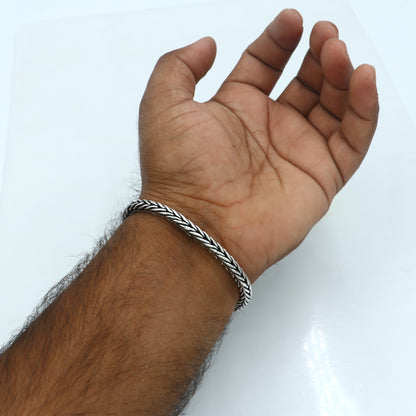 Unisex 8-inch 8.5mm 925 sterling silver wheat design chain bracelet by TRIBAL ORNAMENTS, showcasing detailed craftsmanship.