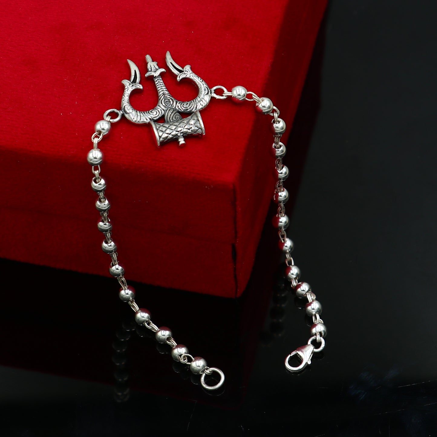 Sterling silver Trishul bracelet with black tulsi beads, unisex design by TRIBAL ORNAMENTS, 7.5-inch Trident-inspired jewelry.