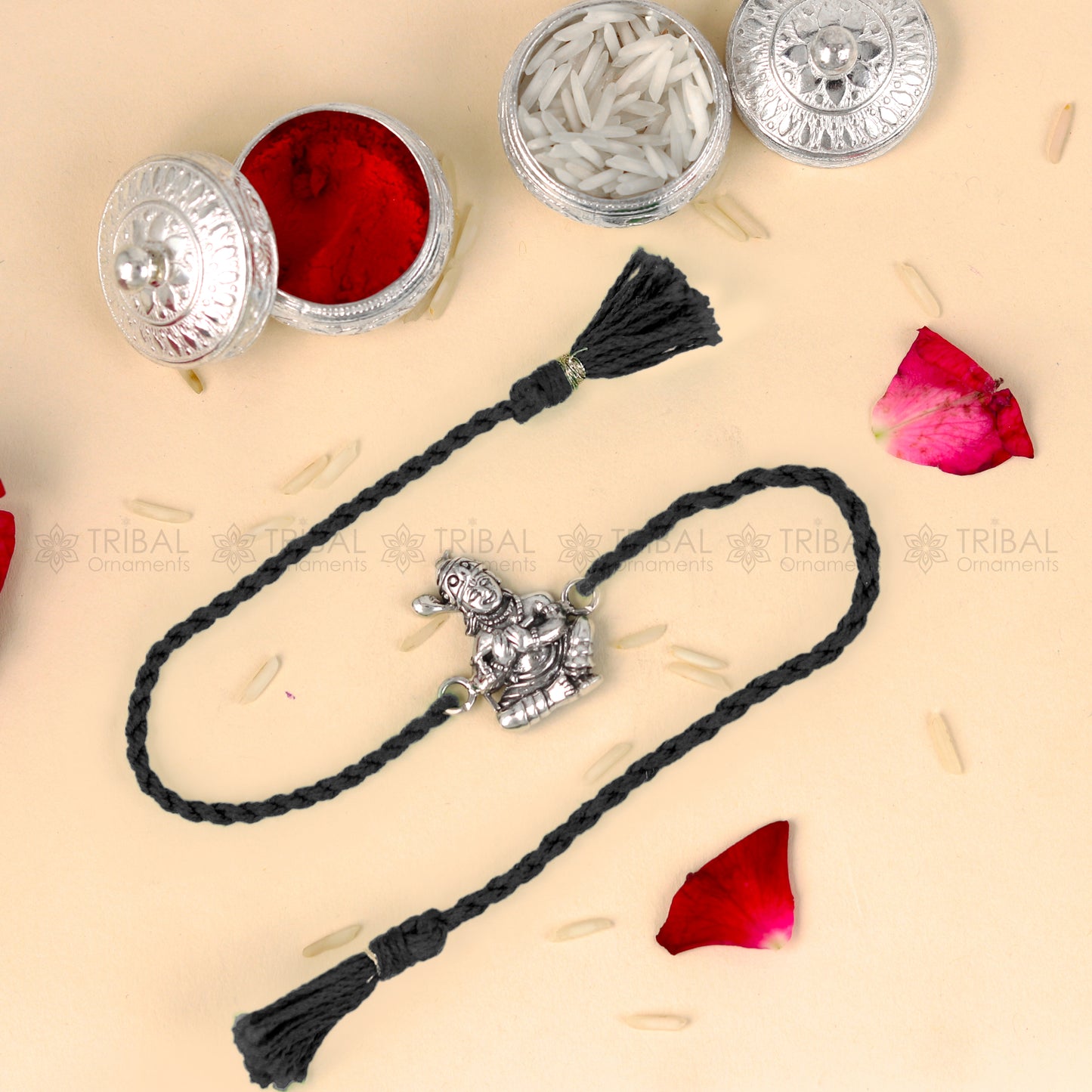 Sterling silver Bal Krishna design thread bracelet with red thread and pendant from TRIBAL ORNAMENTS