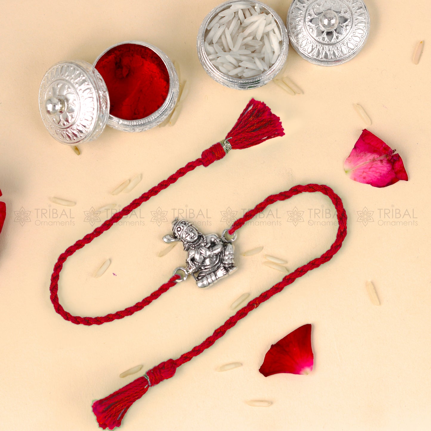 925 Sterling silver Bal Krishna thread bracelet with red thread and intricate design from TRIBAL ORNAMENTS