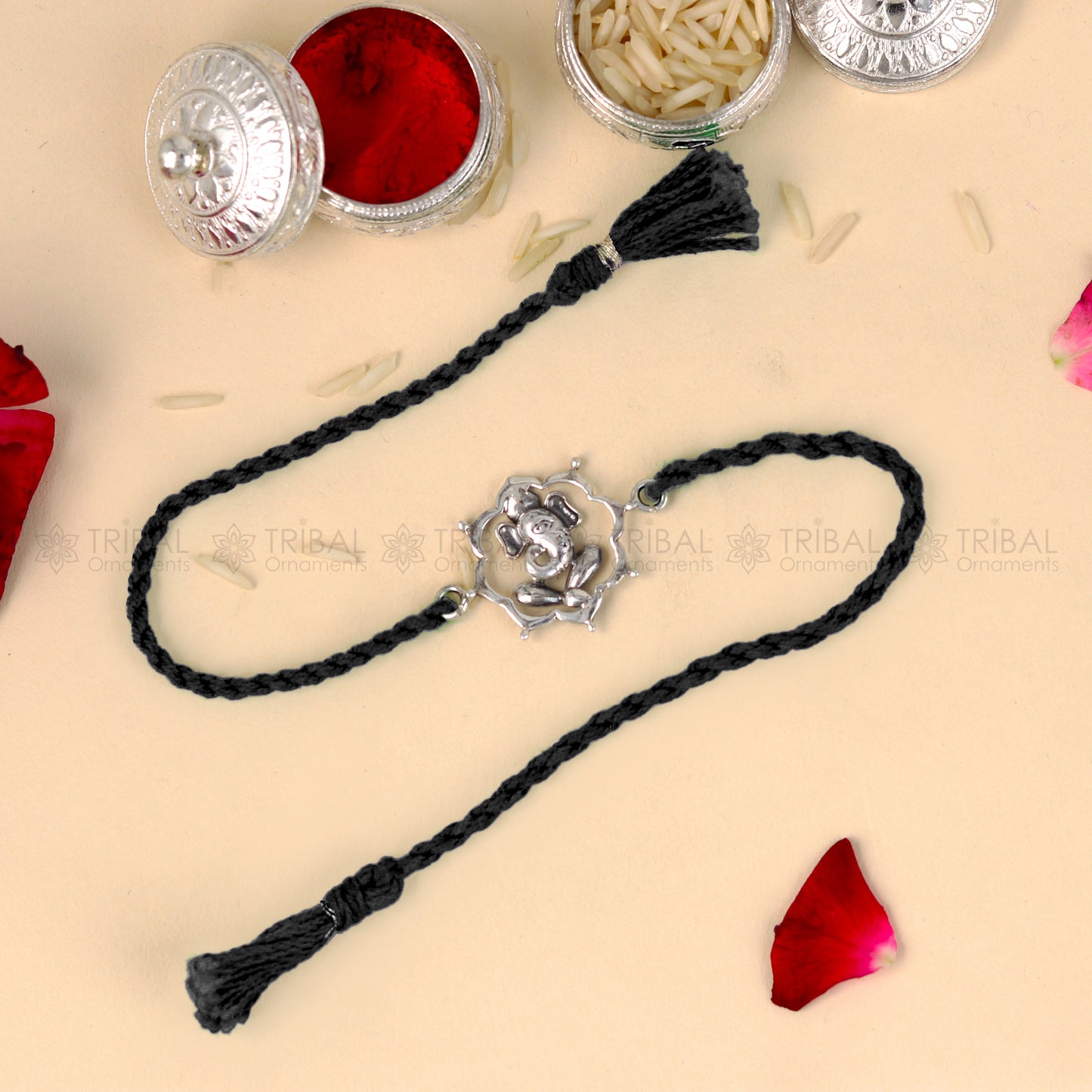 925 Sterling silver Ganesha design thread bracelet with red thread, featuring a decorative pendant from TRIBAL ORNAMENTS.