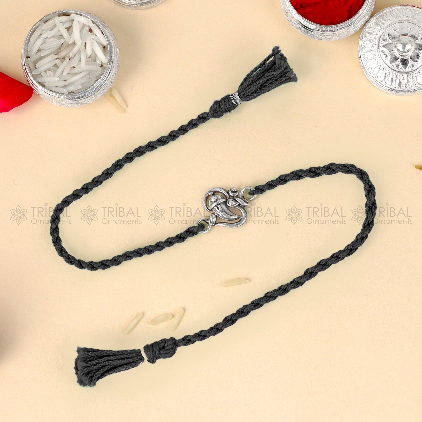 925 Sterling silver Ganesha design thread bracelet with red thread and intricate pendant by TRIBAL ORNAMENTS.