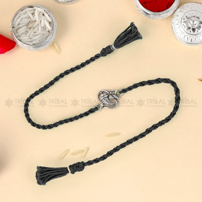 925 Sterling silver Ganesha design thread bracelet with red thread and intricate pendant by TRIBAL ORNAMENTS.