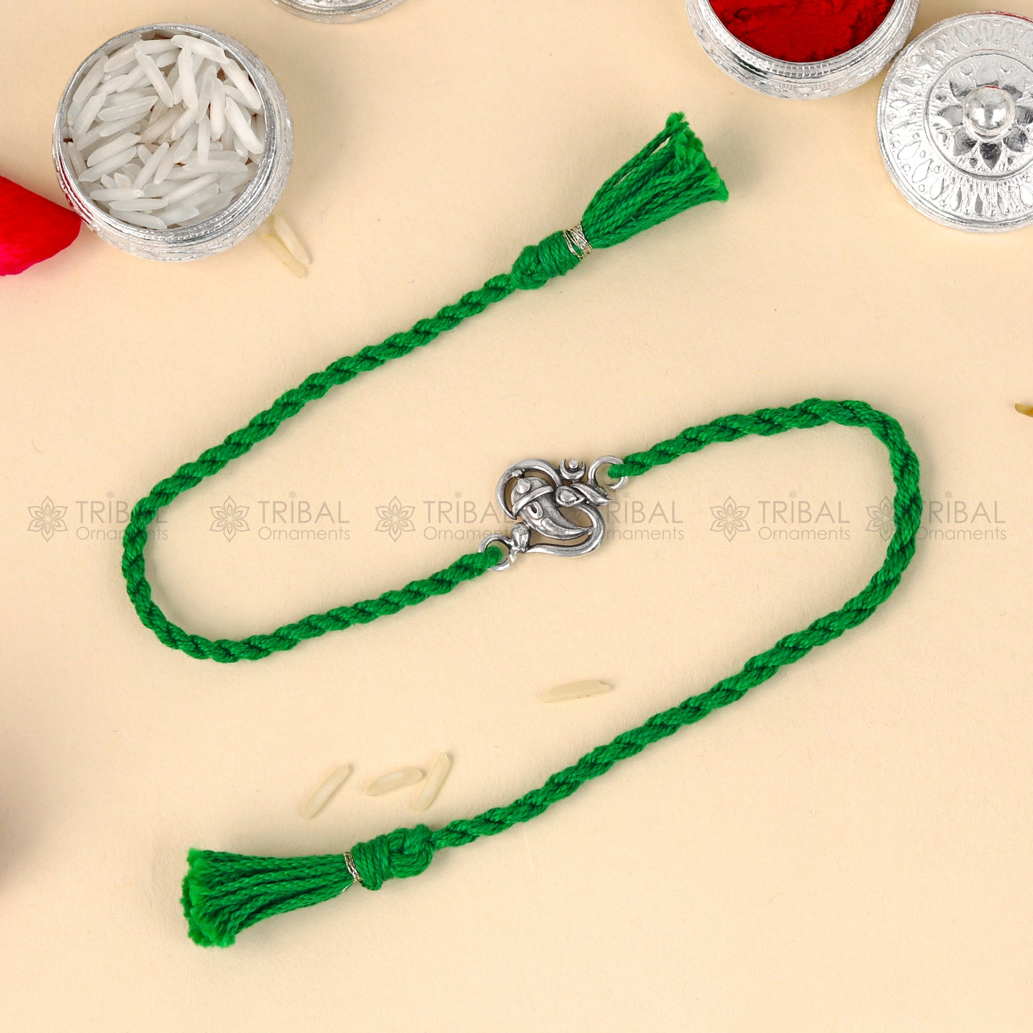 925 Sterling silver Ganesha design thread bracelet with red thread by TRIBAL ORNAMENTS, featuring a detailed Ganesha pendant.