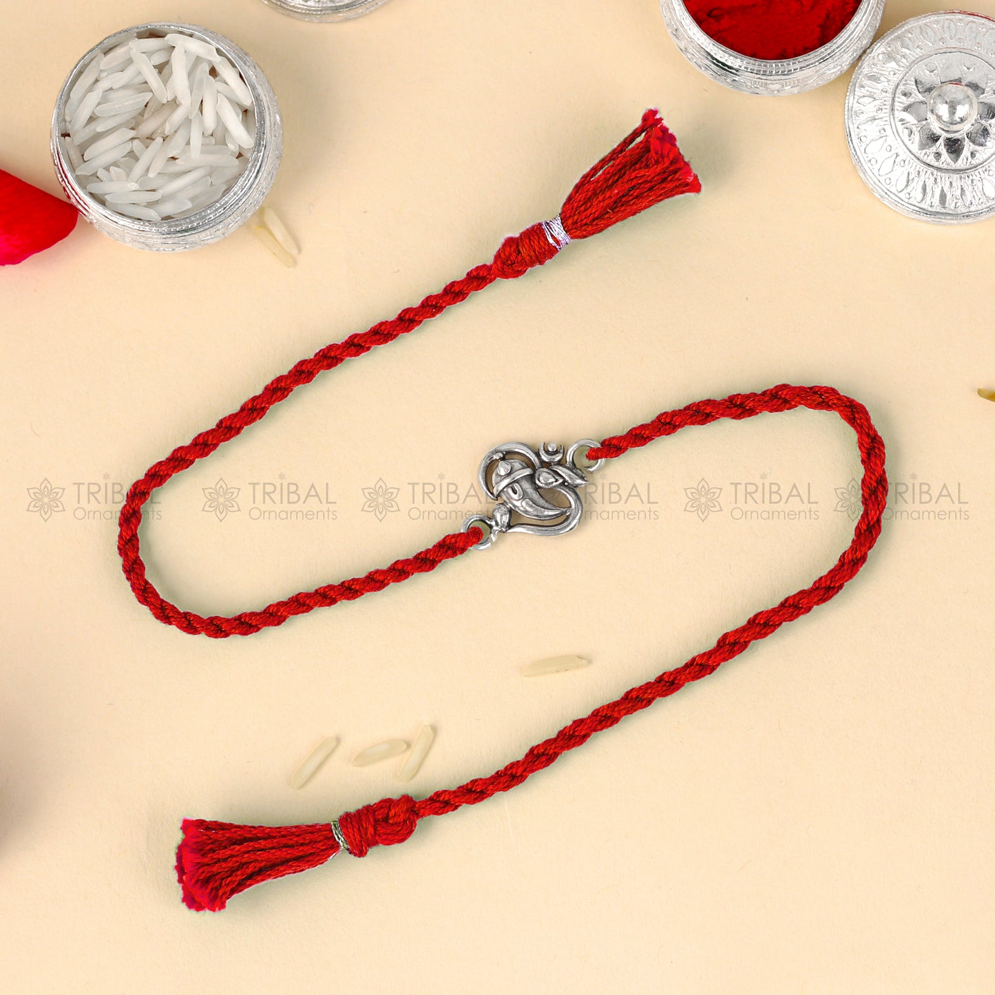 Sterling silver Ganesha pendant bracelet with red thread, tribal ornaments design, handmade thread rakhi bracelet for festivals.