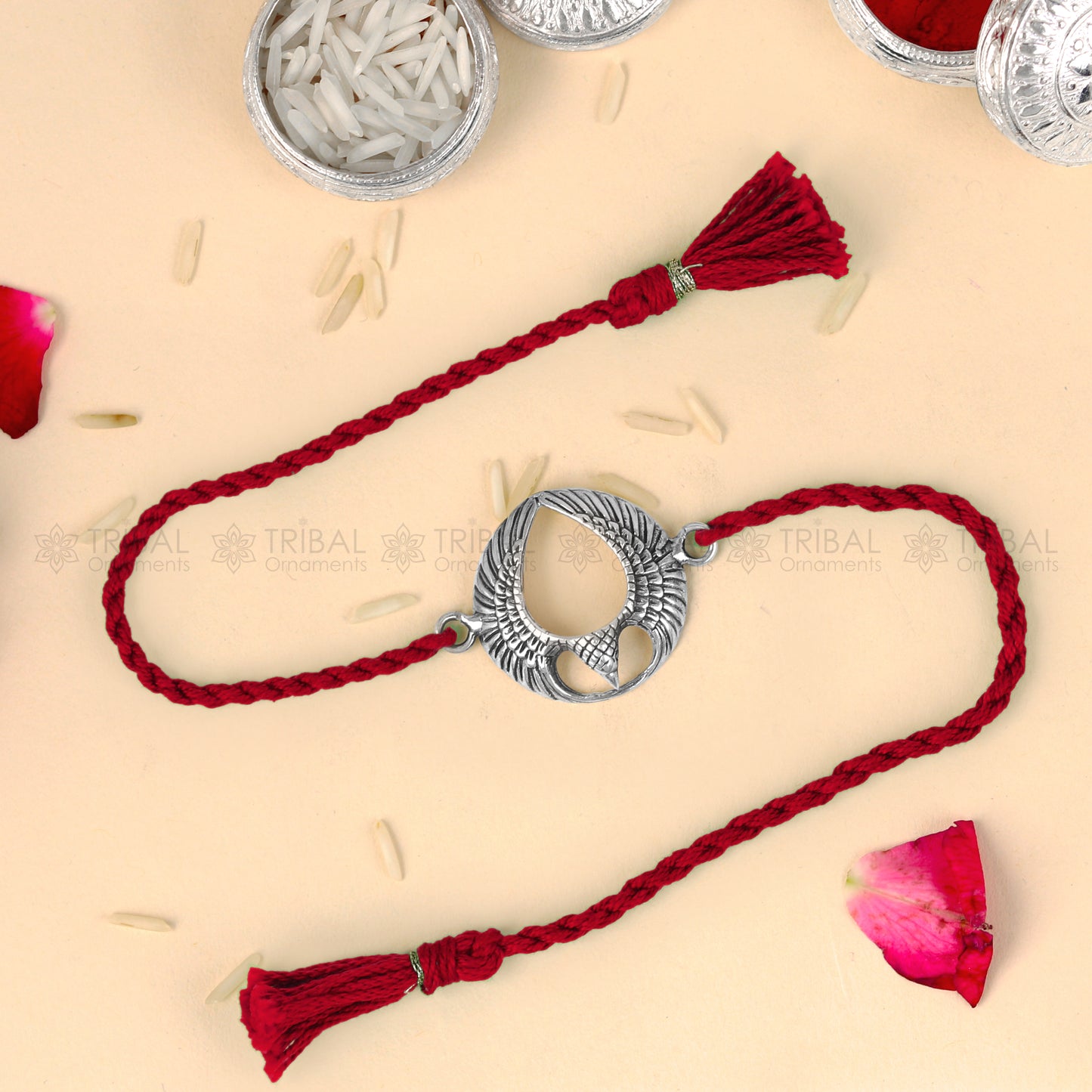 925 sterling silver Garuda design thread rakhi bracelet with red thread and pendant, crafted by TRIBAL ORNAMENTS.