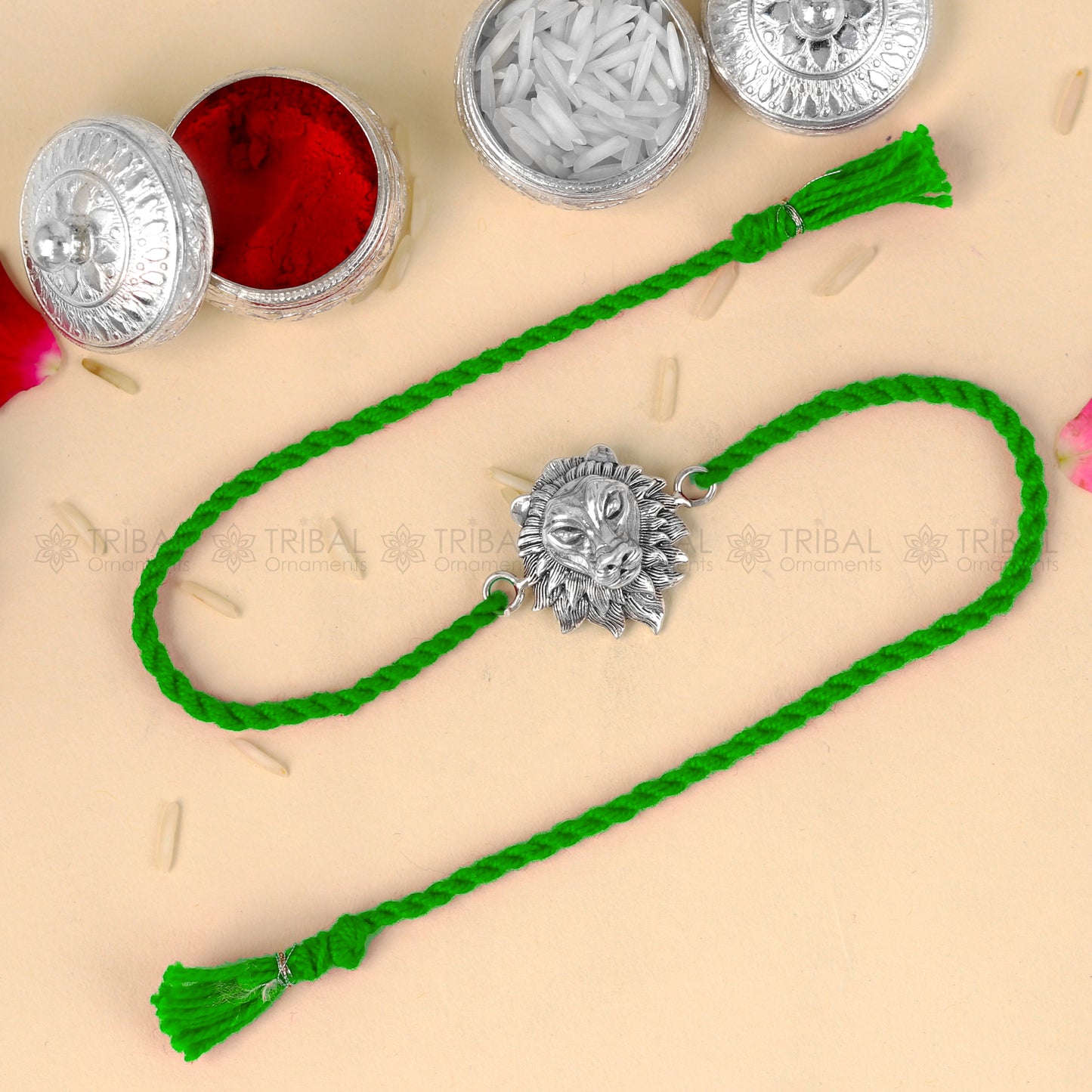 Sterling silver lion face design thread bracelet with red thread, crafted by TRIBAL ORNAMENTS for Rakshabandhan festival.
