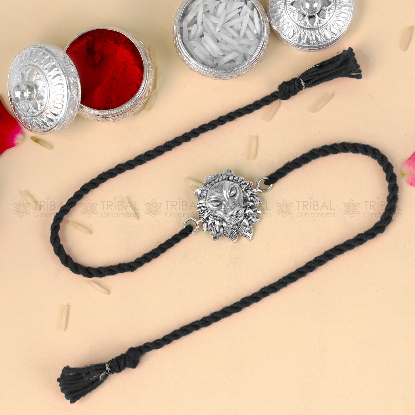 Sterling silver lion face design thread rakhi bracelet by TRIBAL ORNAMENTS with red thread for Rakshabandhan festival.