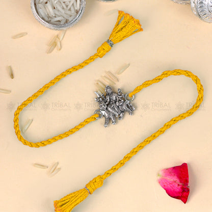 Sterling silver Lord Bhawani Maa design thread bracelet with red thread from TRIBAL ORNAMENTS, featuring intricate pendant.