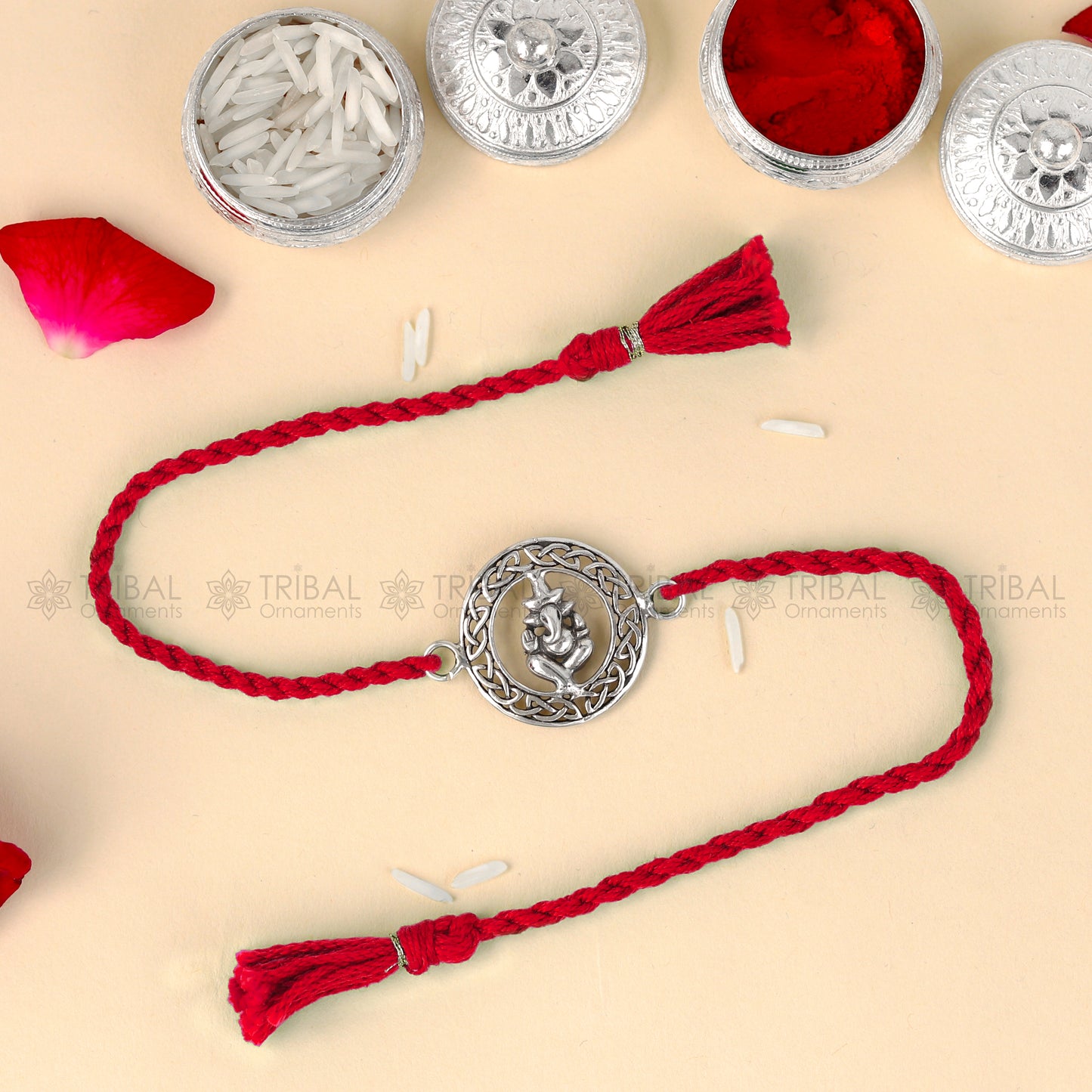 Sterling silver Lord Ganesha design thread bracelet with red thread, crafted by TRIBAL ORNAMENTS.