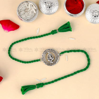 Sterling silver Lord Ganesha thread bracelet from TRIBAL ORNAMENTS with red thread and Ganesha pendant design.
