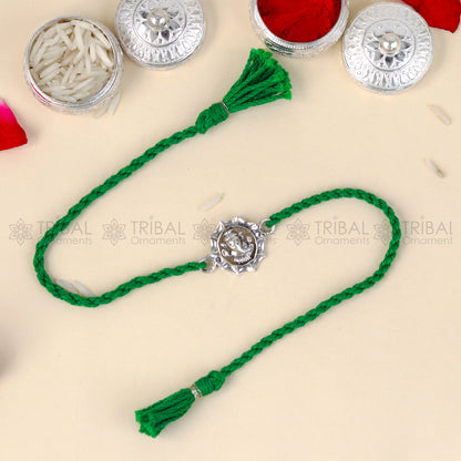 Sterling silver Lord Ganesha design thread bracelet with red thread from TRIBAL ORNAMENTS, featuring a detailed Ganesha pendant.