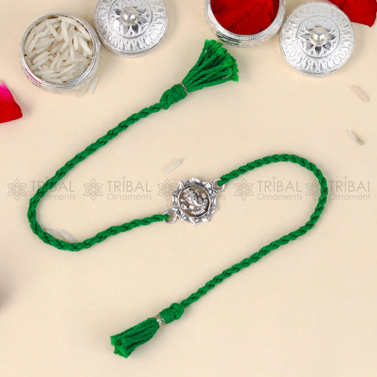 Sterling silver Lord Ganesha design thread bracelet with red thread from TRIBAL ORNAMENTS, featuring a detailed Ganesha pendant.