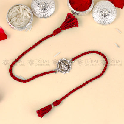 925 Sterling silver Lord Ganesha thread bracelet with red thread and intricate Ganesha pendant design by TRIBAL ORNAMENTS