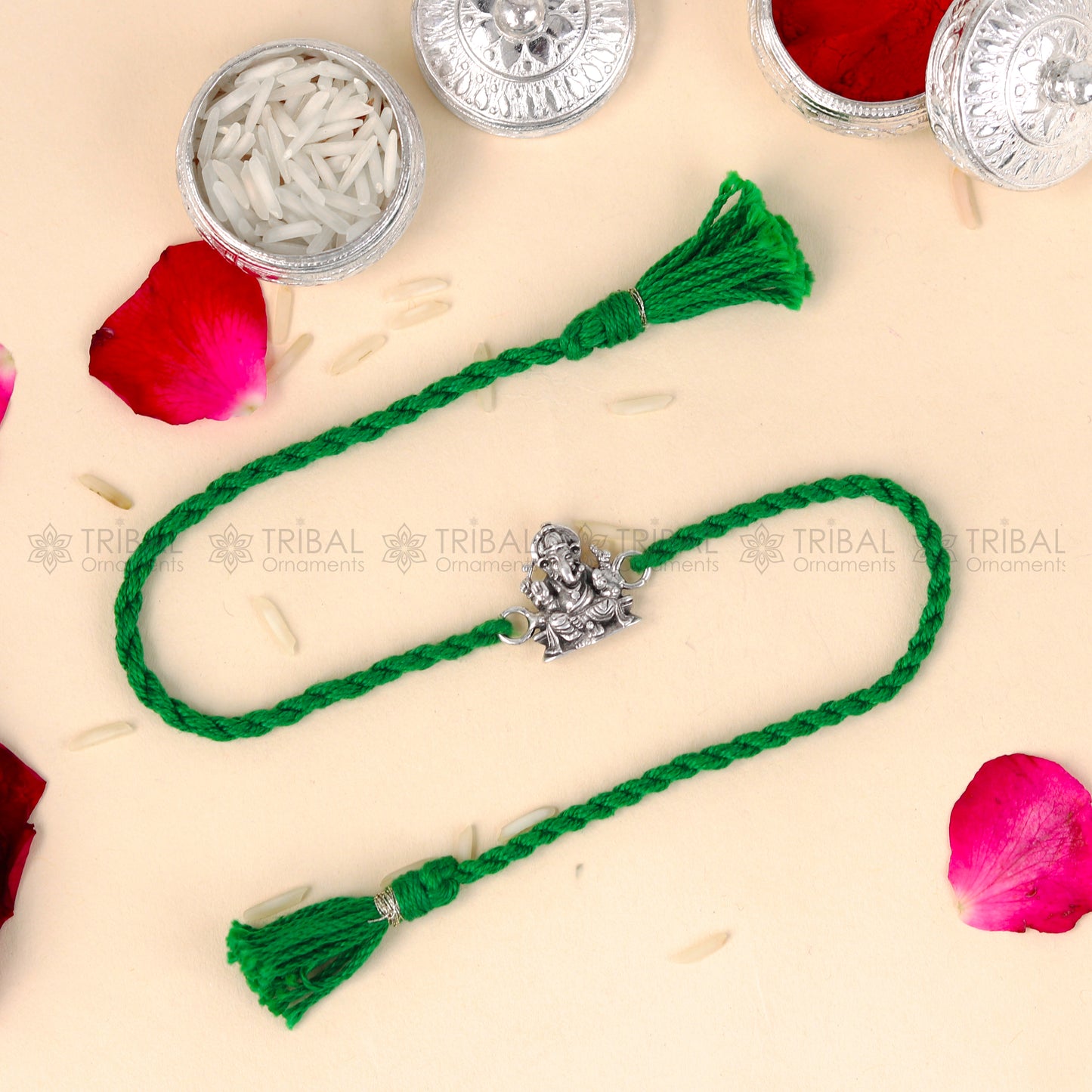Sterling silver Lord Ganesha thread rakhi bracelet with red thread and Ganesha pendant by TRIBAL ORNAMENTS