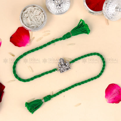 Sterling silver Lord Ganesha thread rakhi bracelet with red thread and Ganesha pendant by TRIBAL ORNAMENTS