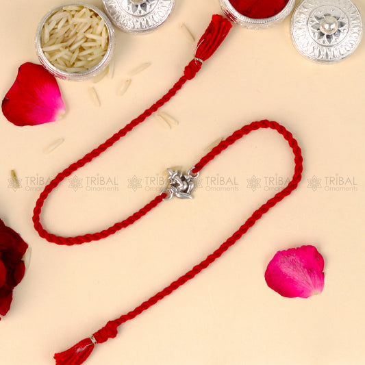 925 Sterling silver Lord Ganesha thread rakhi bracelet with red thread and Ganesha pendant from TRIBAL ORNAMENTS.