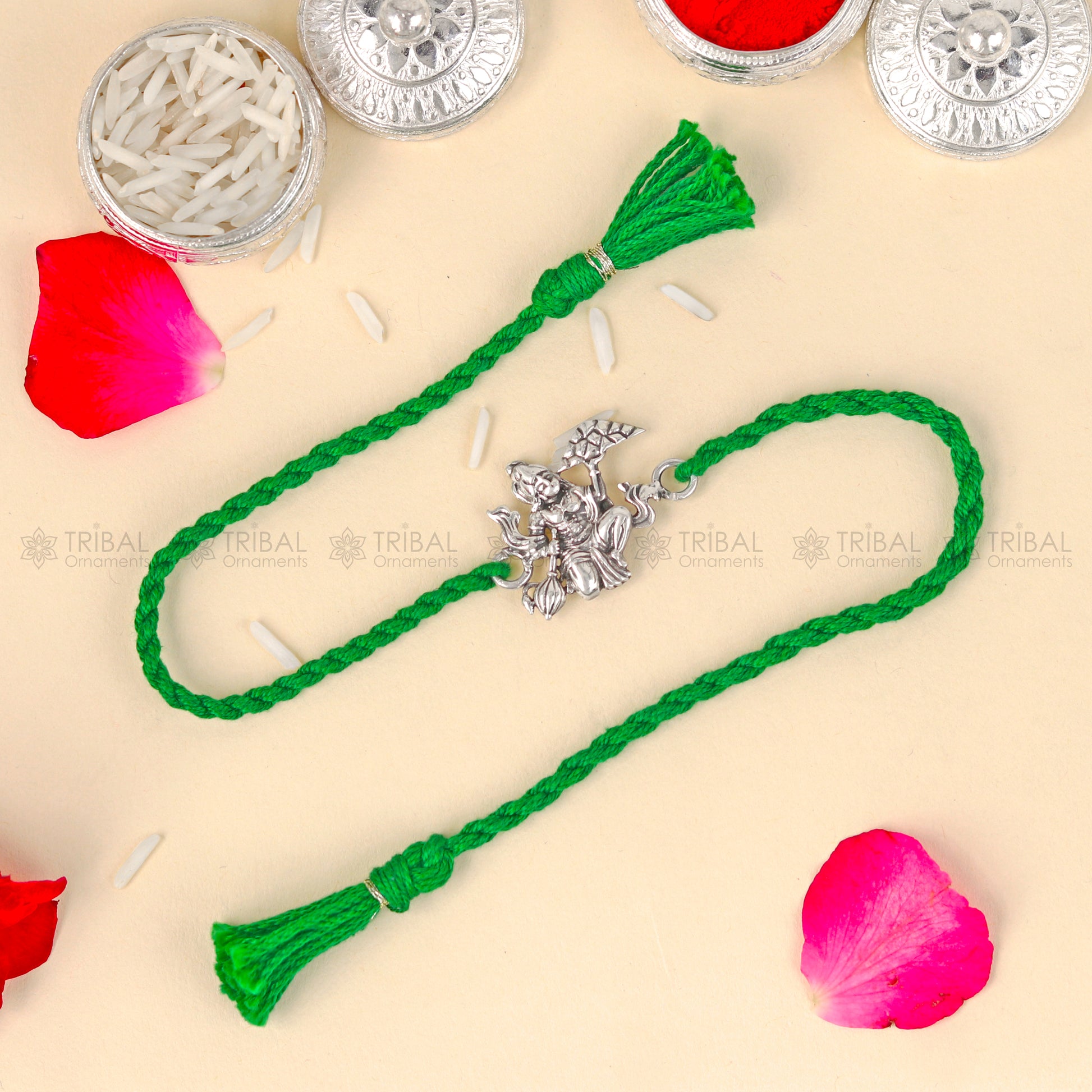 Sterling silver Lord Hanuman design thread bracelet with red thread from TRIBAL ORNAMENTS, featuring detailed pendant.