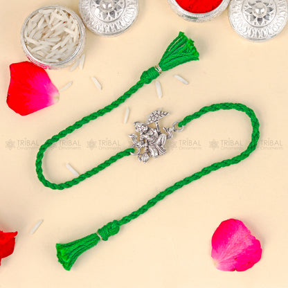 Sterling silver Lord Hanuman design thread bracelet with red thread from TRIBAL ORNAMENTS, featuring detailed pendant.