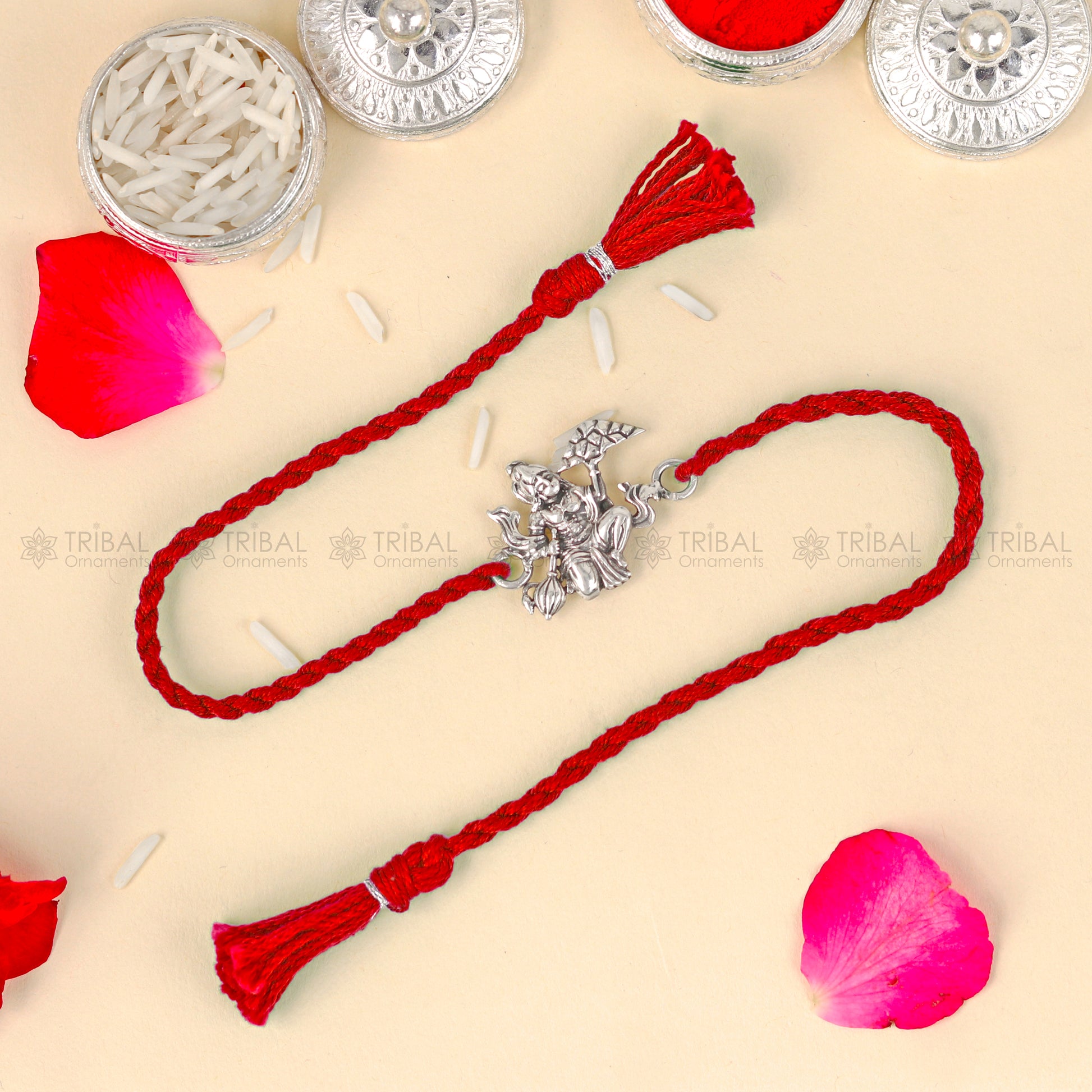 925 Sterling silver Lord Hanuman design thread bracelet with red thread from TRIBAL ORNAMENTS featuring a pendant.