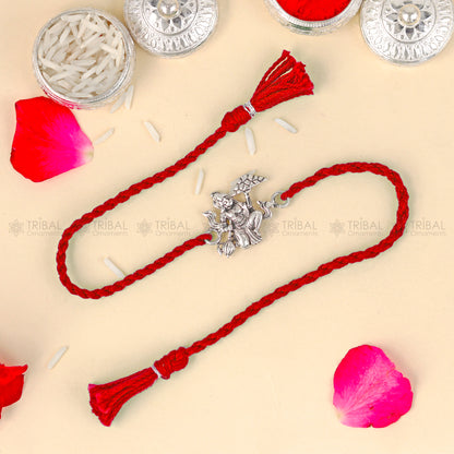 925 Sterling silver Lord Hanuman design thread bracelet with red thread from TRIBAL ORNAMENTS featuring a pendant.
