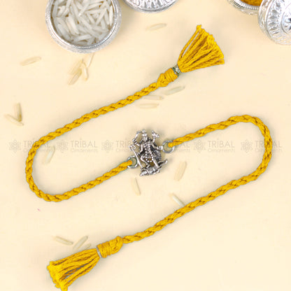 925 Sterling silver Lord Kali Maa with Shiv Ji design thread rakhi bracelet by TRIBAL ORNAMENTS featuring red thread and intricate silver detailing.