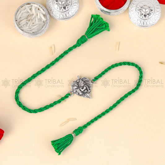 925 Sterling silver Lord Laddu Gopala design thread bracelet with red thread and intricate pendant by TRIBAL ORNAMENTS.