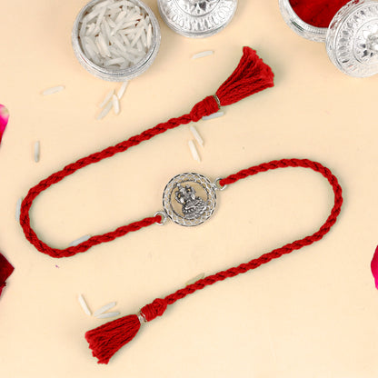 925 Sterling silver Lord Laxmi ji design thread rakhi bracelet with red thread and pendant, crafted by TRIBAL ORNAMENTS.