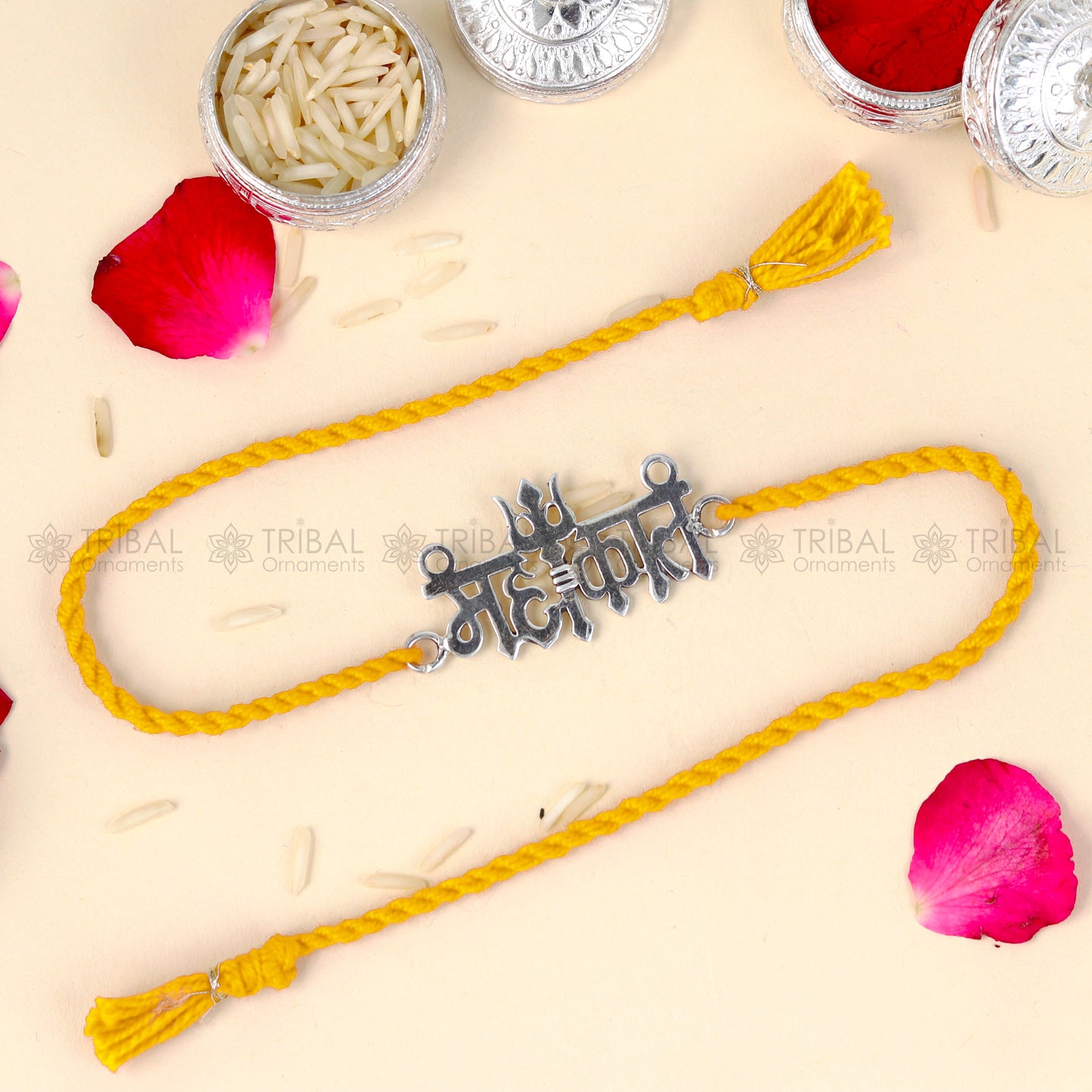 925 Sterling silver Lord Mahakal design thread rakhi bracelet with red thread from TRIBAL ORNAMENTS featuring pendant detailing.