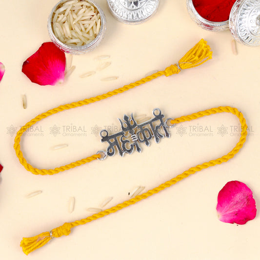 925 Sterling silver Lord Mahakal design thread rakhi bracelet with red thread from TRIBAL ORNAMENTS featuring pendant detailing.