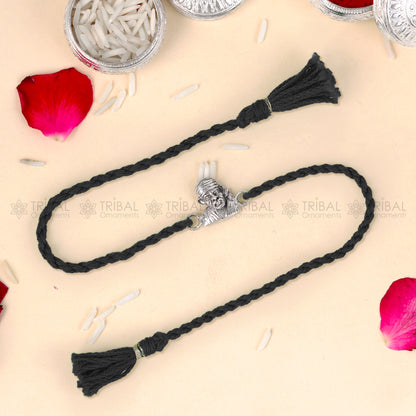 925 Sterling silver Lord Om Sai Ram design thread rakhi bracelet with red thread and pendant from TRIBAL ORNAMENTS.