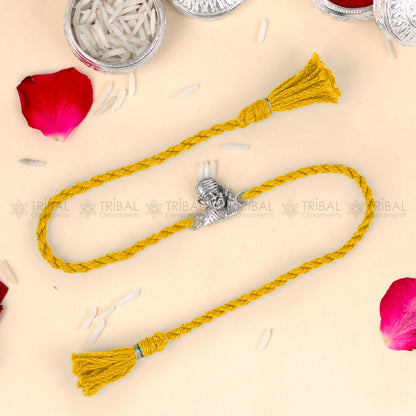 925 Sterling silver Lord Om Sai Ram design thread rakhi bracelet with red thread from TRIBAL ORNAMENTS.