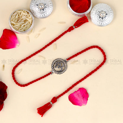 Sterling silver Lord Om Shiv mantra bracelet with red thread and pendant, crafted by TRIBAL ORNAMENTS.