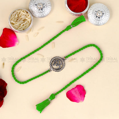 Sterling silver Lord Om and Shiv mantra design thread bracelet with red thread from TRIBAL ORNAMENTS.
