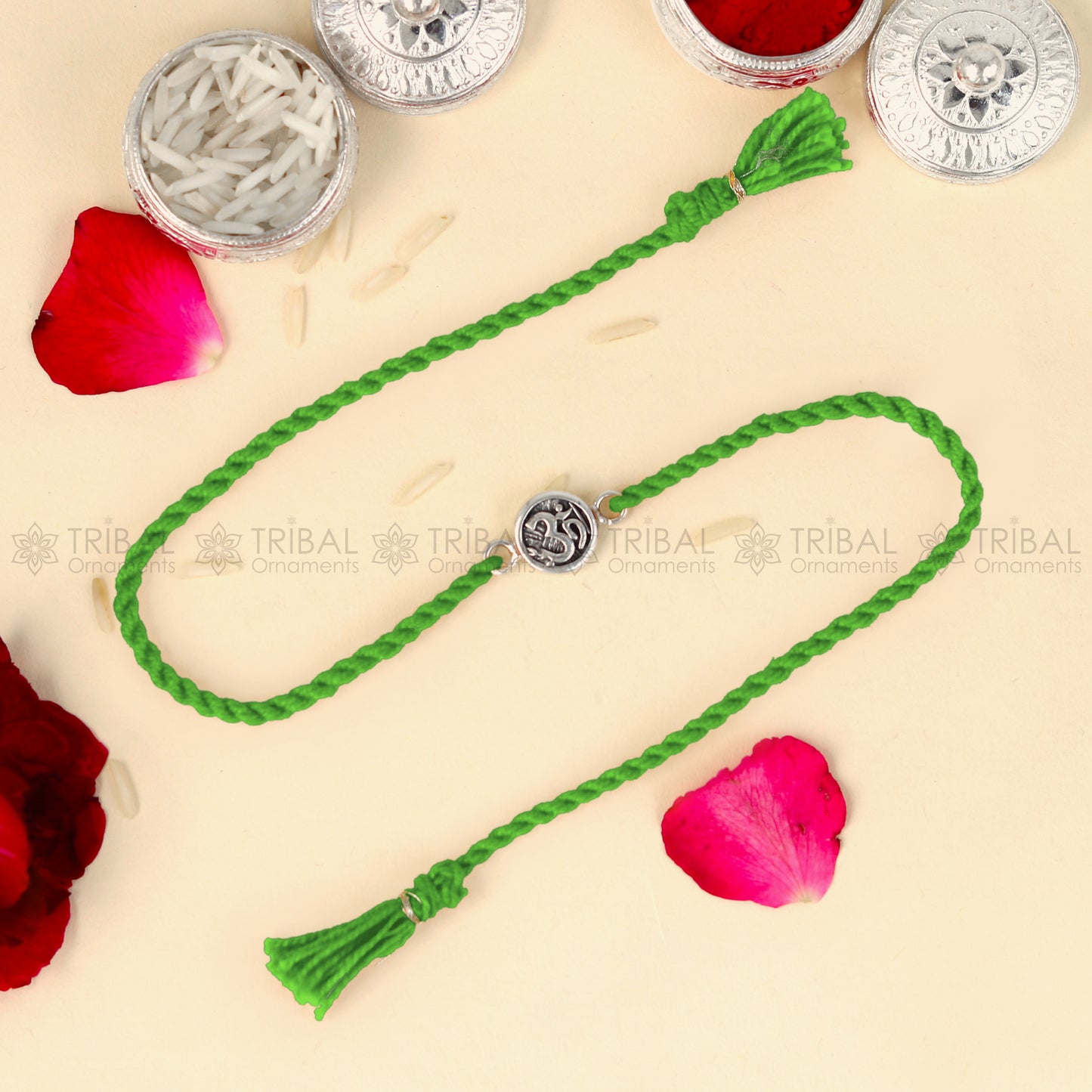 Sterling silver Lord Om Shiv mantra design bracelet with red thread from TRIBAL ORNAMENTS featuring a detailed pendant.