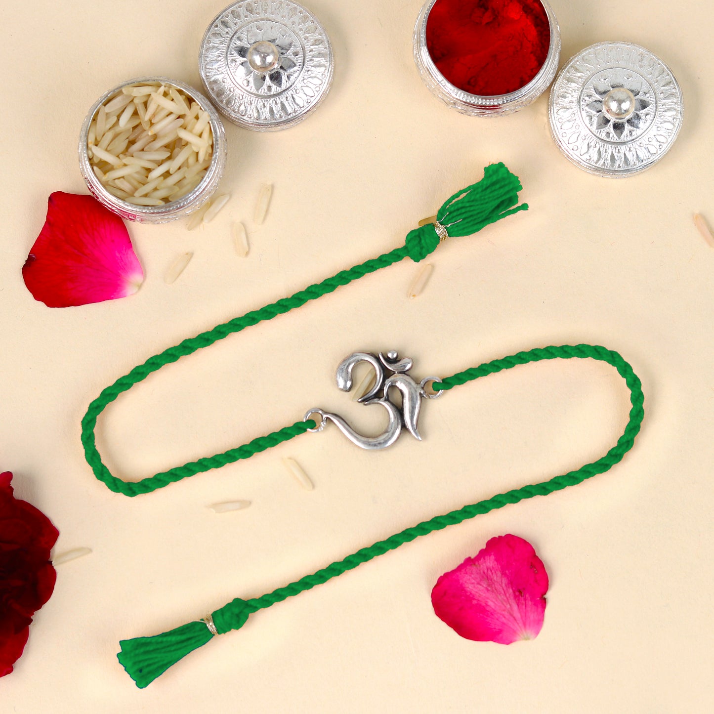 Sterling silver Lord Om Shiv mantra design bracelet with red thread from TRIBAL ORNAMENTS, featuring a detailed pendant.