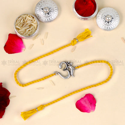 Sterling silver Lord Om Shiv mantra thread bracelet with red thread and pendant, designed by Tribal Ornaments.