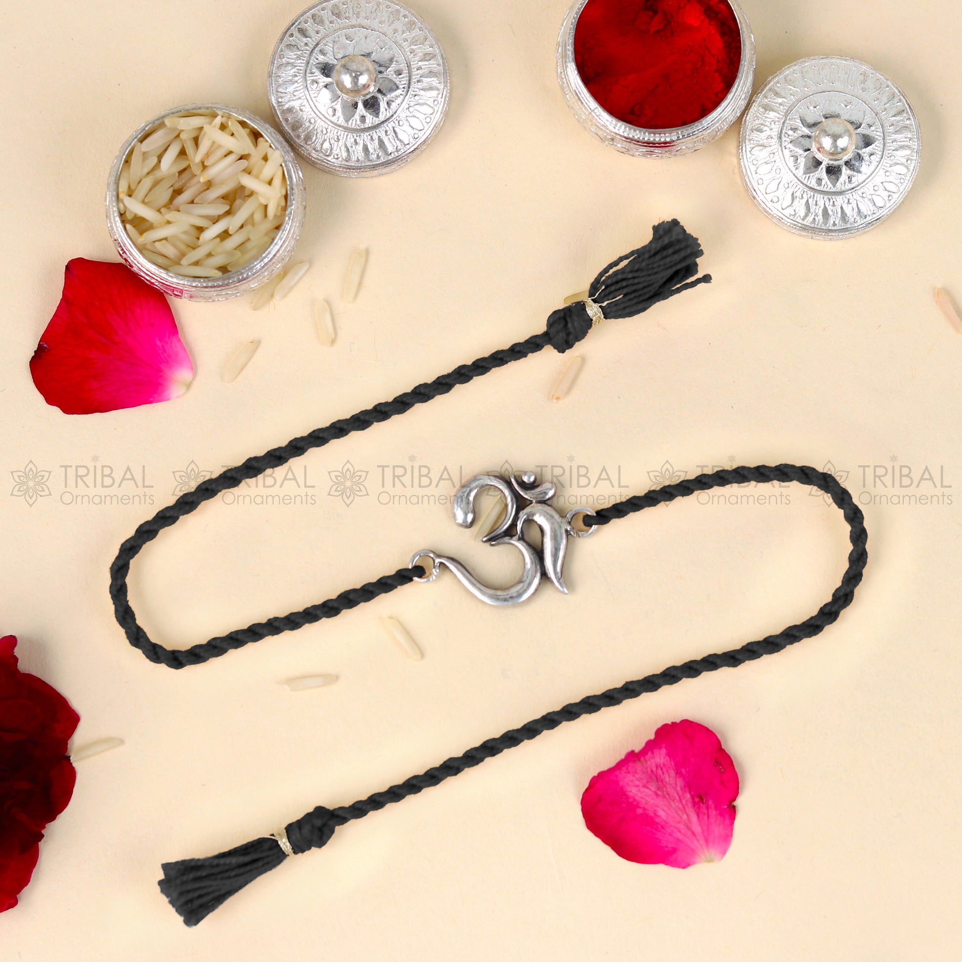 Sterling silver Lord Om and Shiv mantra design thread bracelet with red thread from TRIBAL ORNAMENTS.