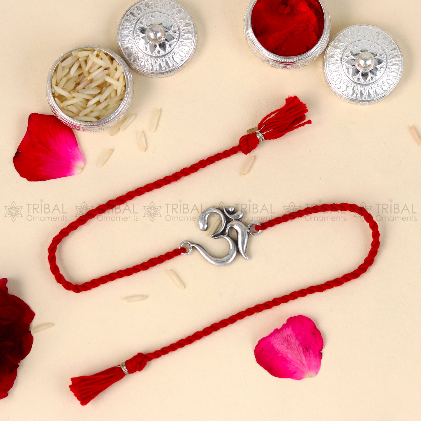 Sterling silver Lord Om Shiv mantra design bracelet with red thread from TRIBAL ORNAMENTS, featuring a detailed pendant.