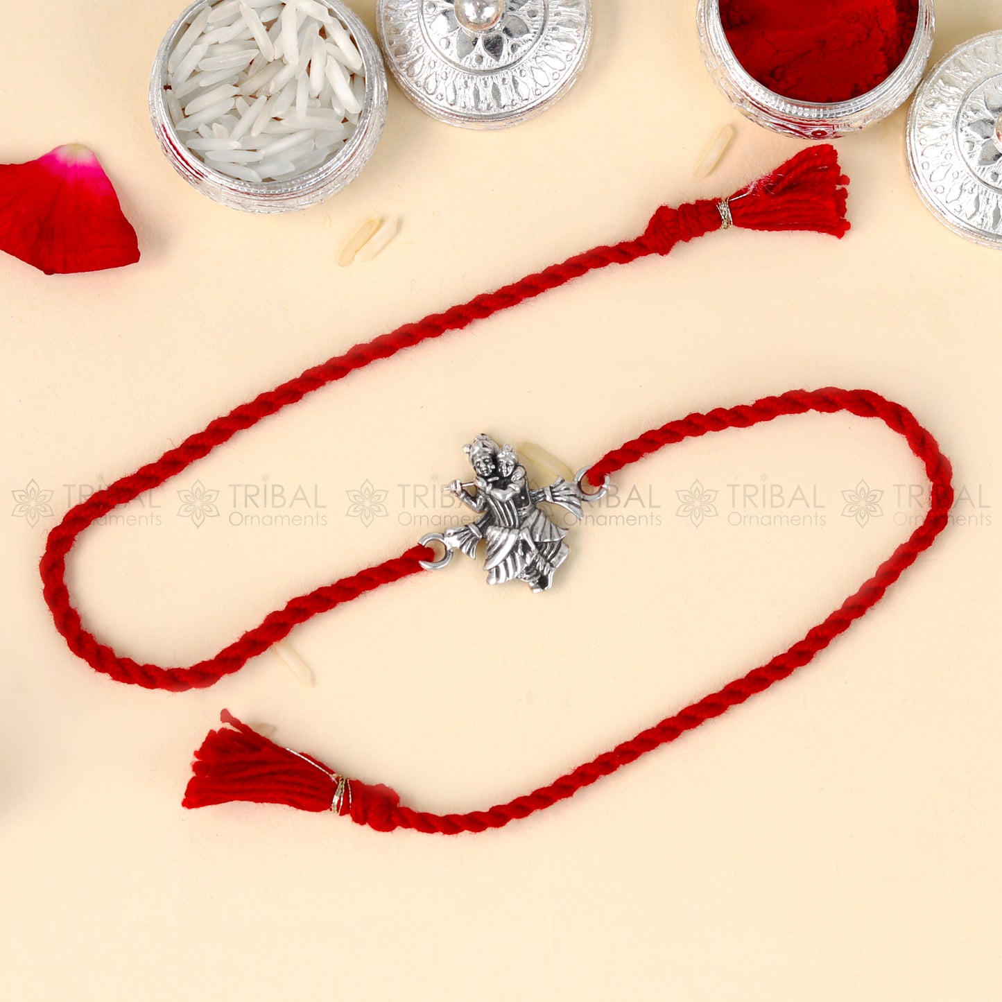 925 Sterling silver Lord Radhe Krishna design thread bracelet with red thread and pendant, from TRIBAL ORNAMENTS.