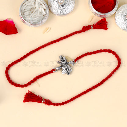 925 Sterling silver Lord Radhe Krishna design thread bracelet with red thread and pendant, from TRIBAL ORNAMENTS.