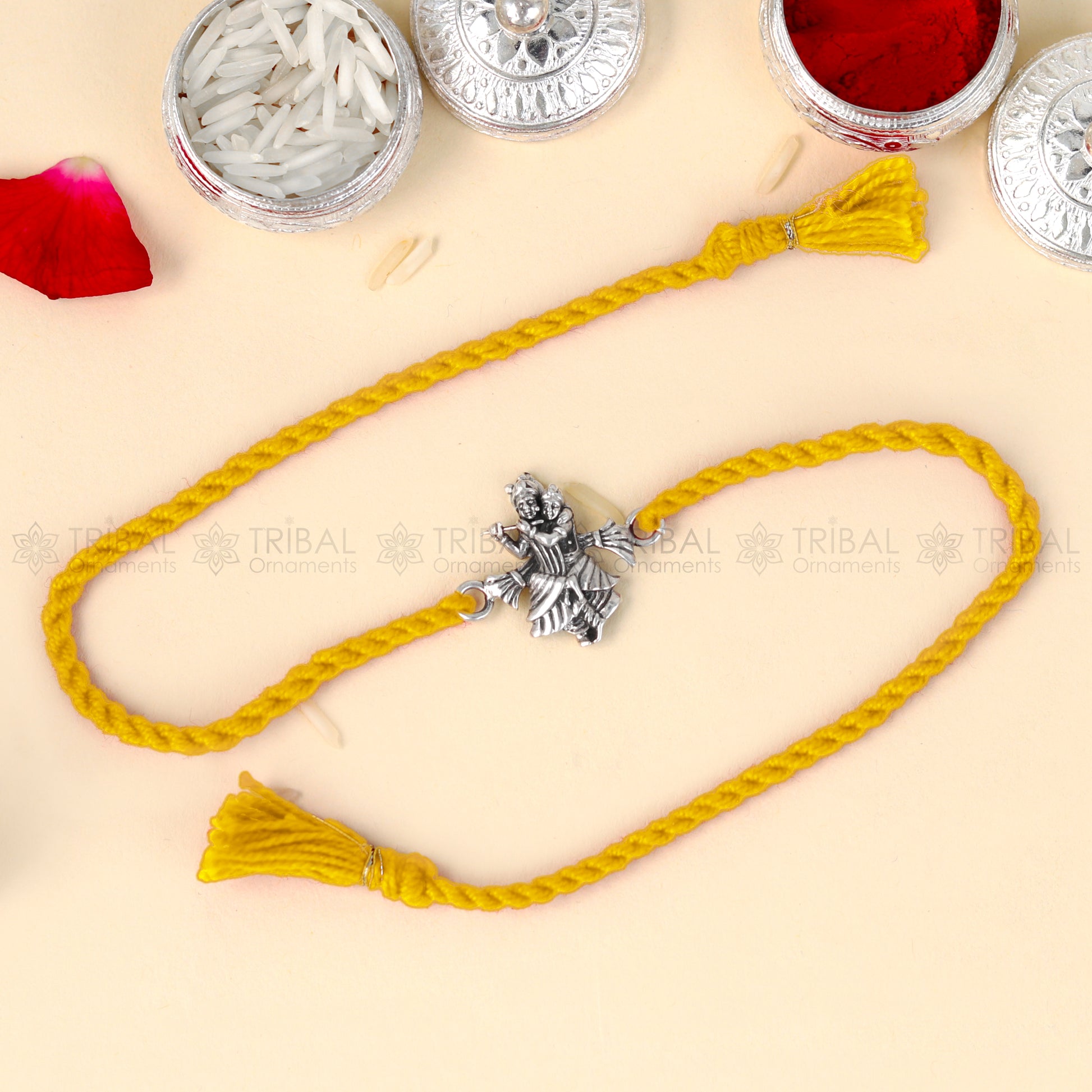 Sterling silver Lord Radhe Krishna thread bracelet with intricate design by TRIBAL ORNAMENTS featuring a pendant.